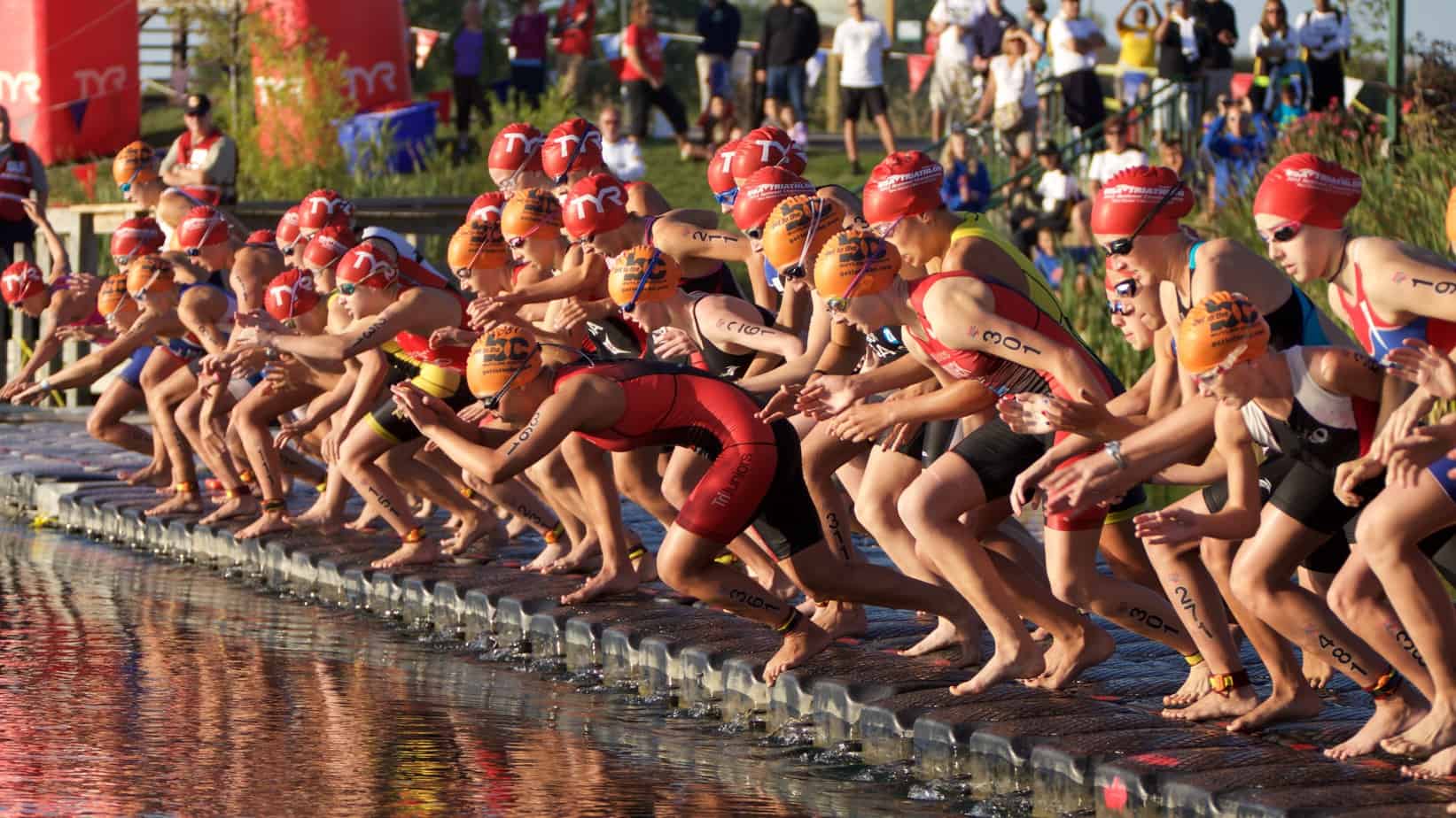 Swimmers Dive into Water